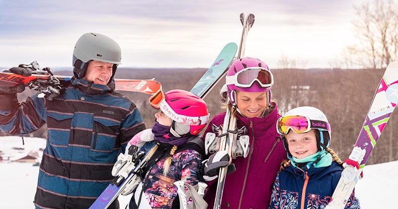 Family enjoying a winter vacation at Treetops Resort